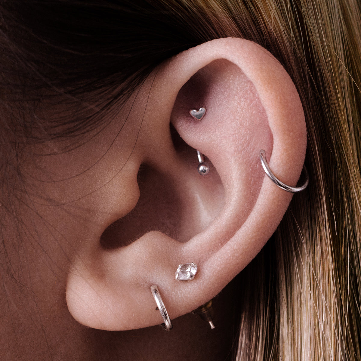 Mini Heart Rook Curved Barbell Piercing On Model - Silver