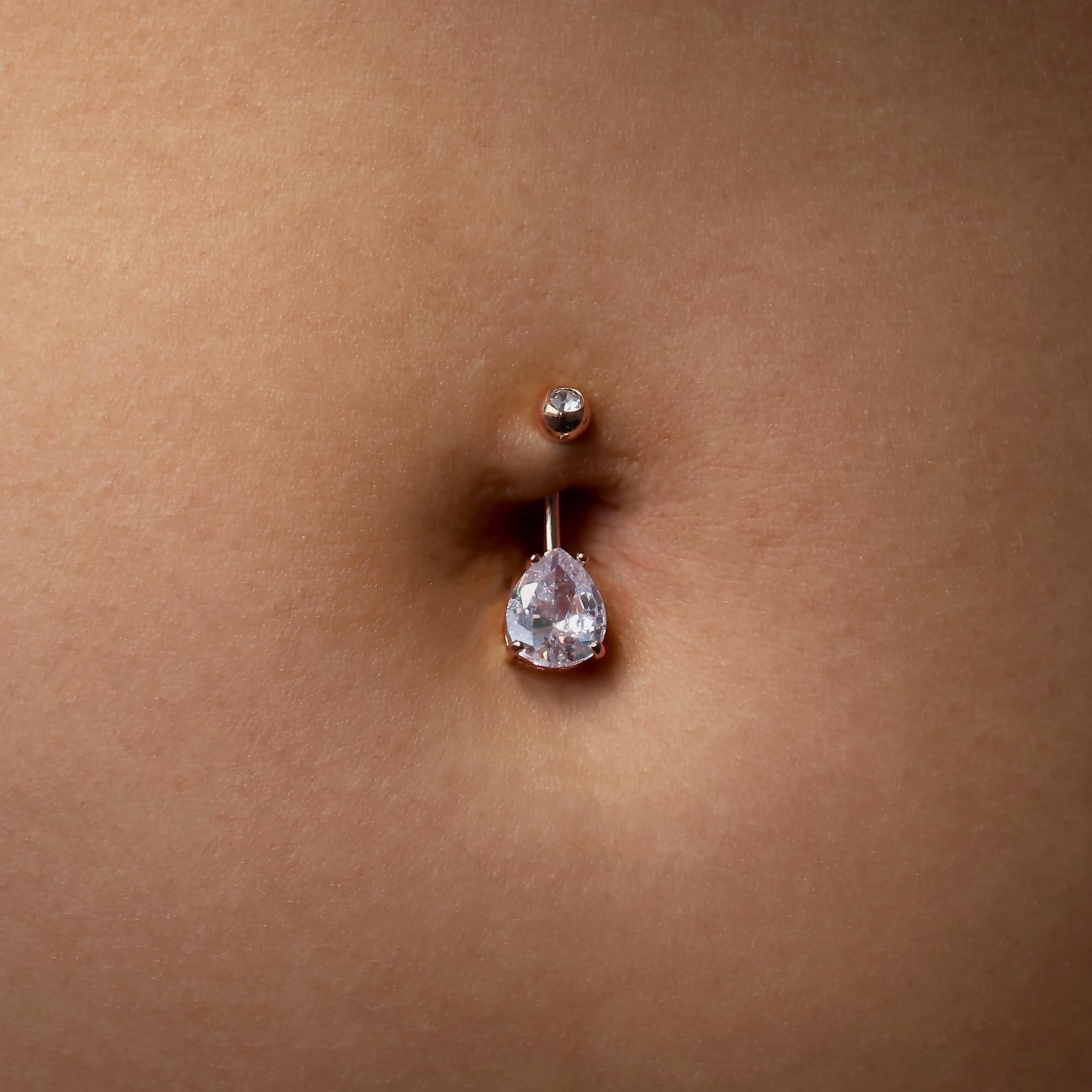 Lume Teardrop Gemstone Belly Bar Piercing On Model - Rose Gold