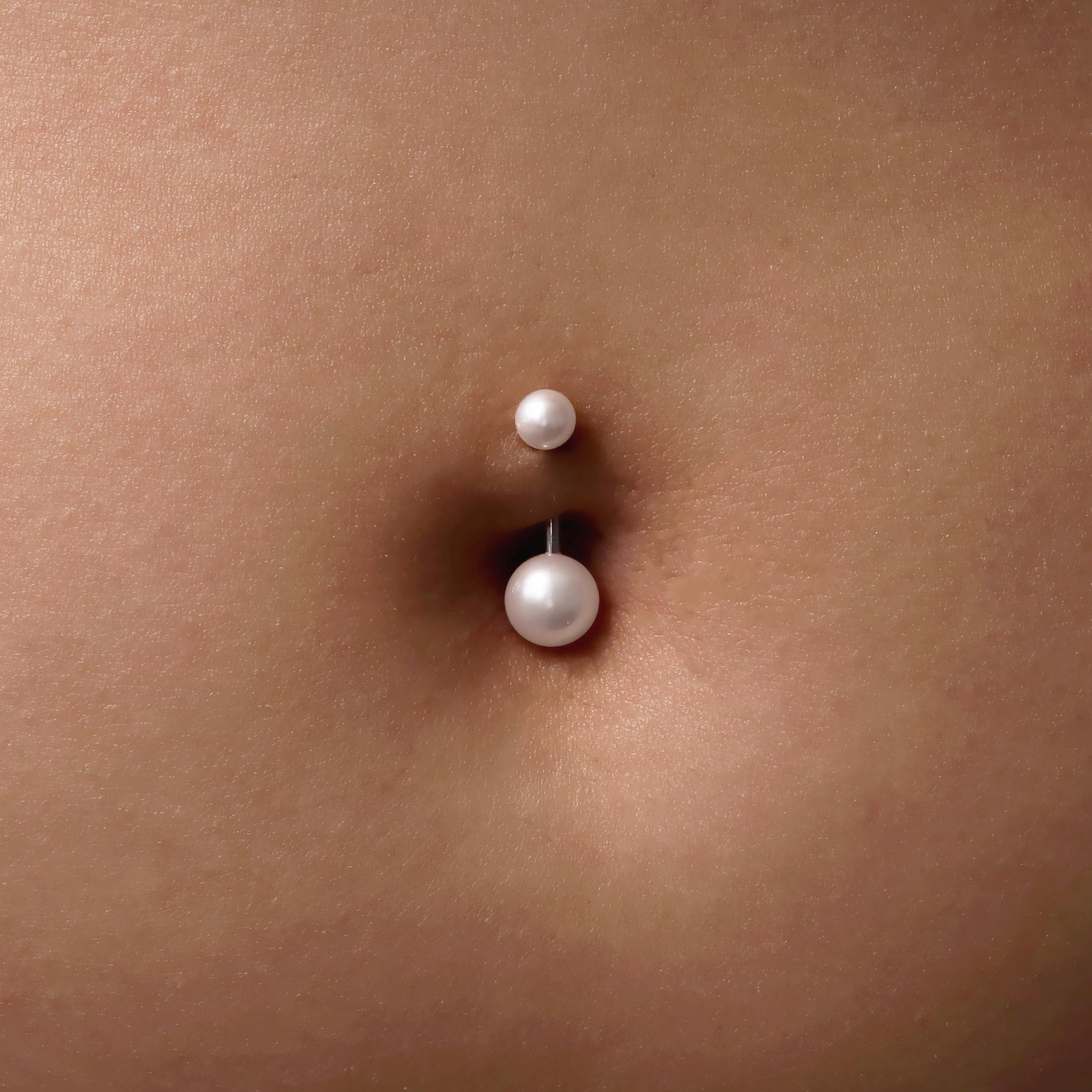 Mira Pearl Belly Bar Piercing On Model - Pearl