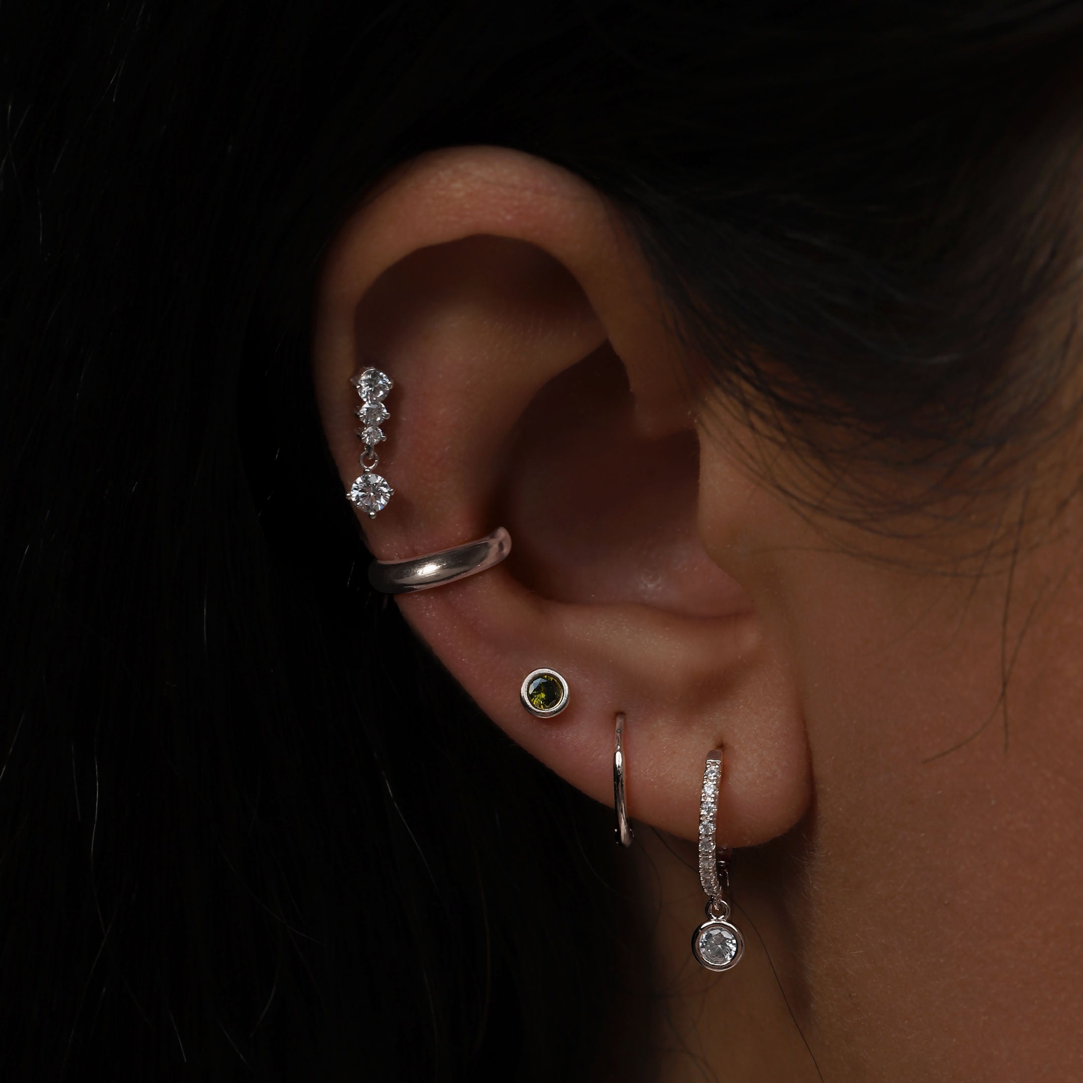 August Birthstone Tragus Helix & Conch Ear Piercing On Model - Sterling Silver