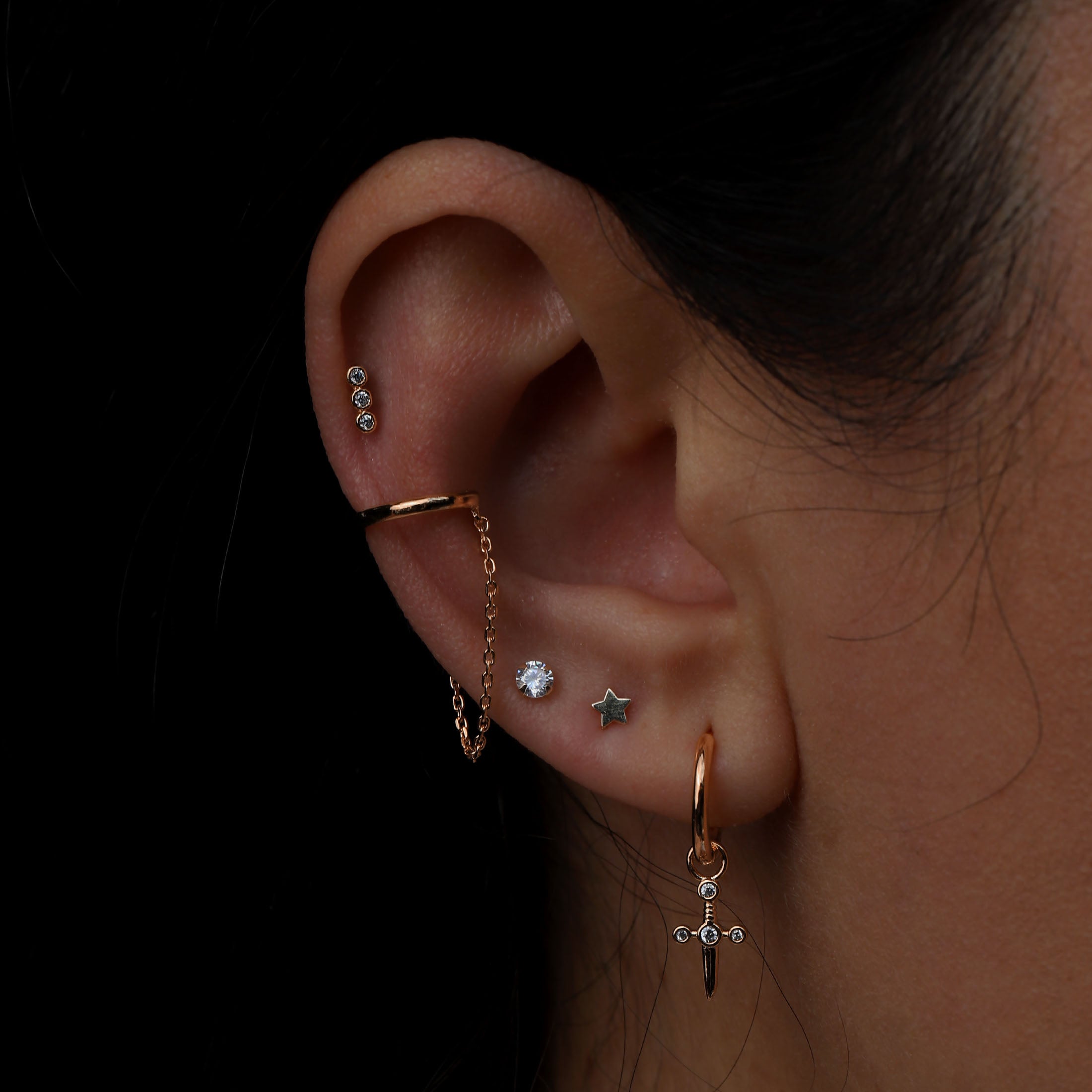 Dagger Charm Huggie Hoop Earrings On Model 2 - Rose Gold