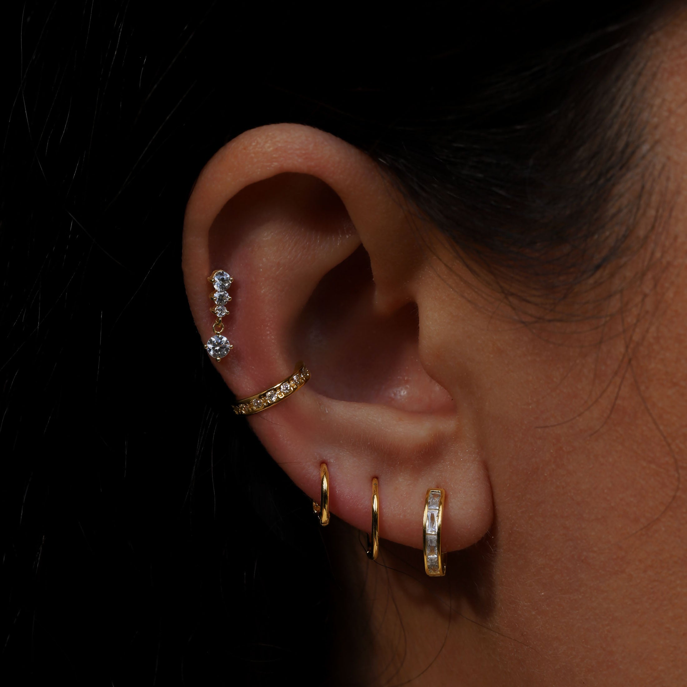 Mini Segment Huggie Hoop Earrings On Model - Gold